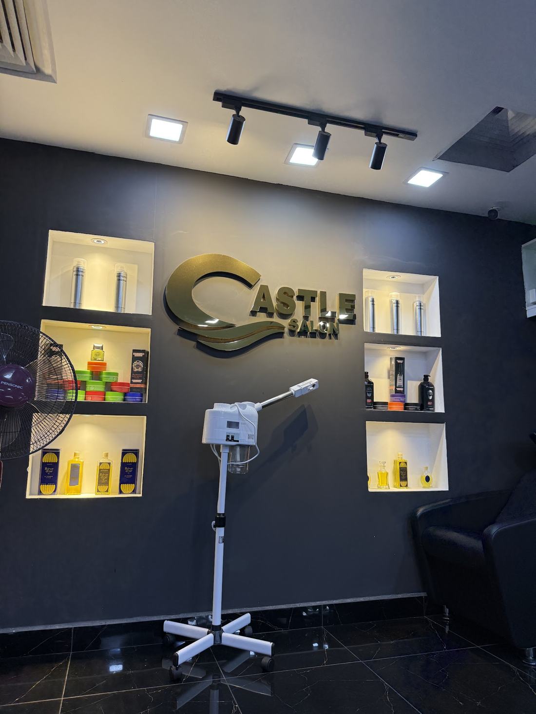 The Castle Salon brass sign